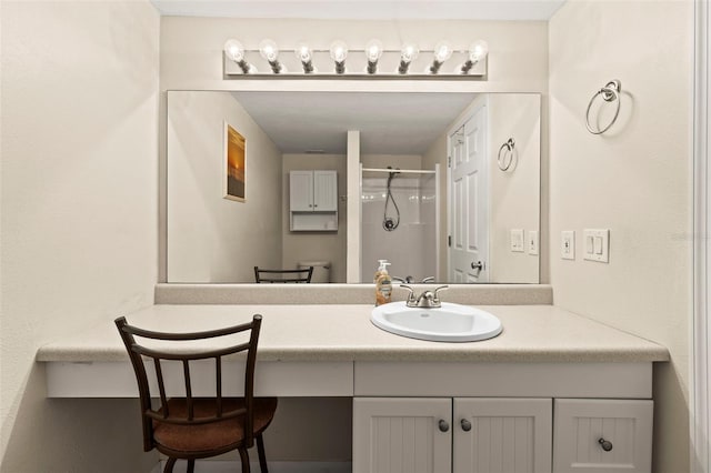 full bathroom featuring walk in shower and vanity