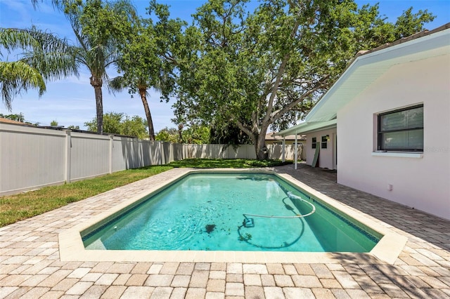 view of pool featuring a fenced backyard and a patio area