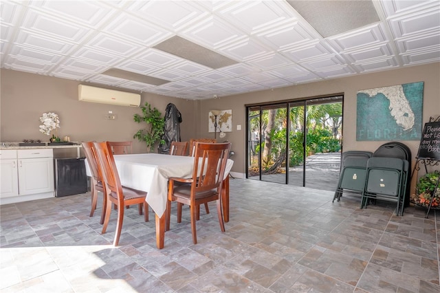 dining space with a wall mounted AC and an ornate ceiling