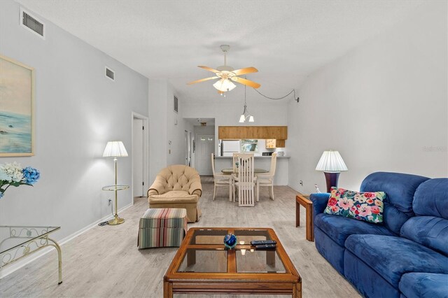39650 US Highway 19 N Unit 553, Tarpon Springs, FL 34689 - living room with light wood-style floors, ceiling fan, and baseboards