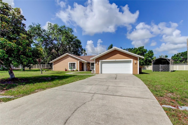 107 Garland Cir, Palm Harbor, FL 34683 - ranch-style house featuring concrete driveway and a garage