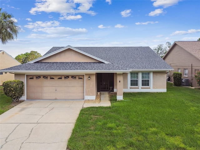 ranch-style house featuring stucco siding, central AC unit, and a garage