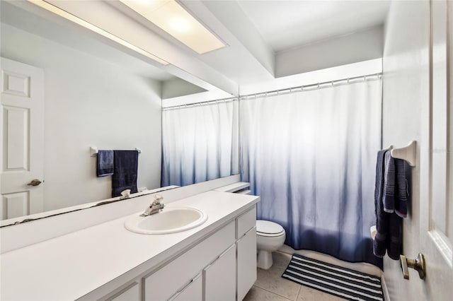bathroom with toilet, vanity, a shower with curtain, and tile patterned floors