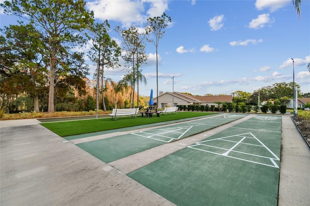 view of home's community featuring shuffleboard