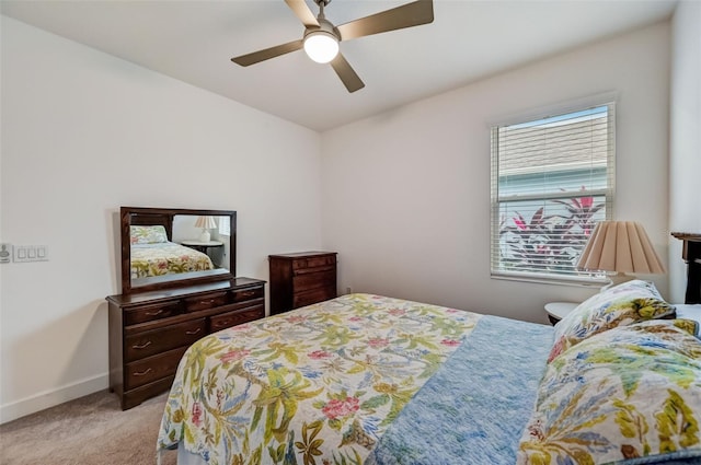 bedroom with light carpet, baseboards, and ceiling fan