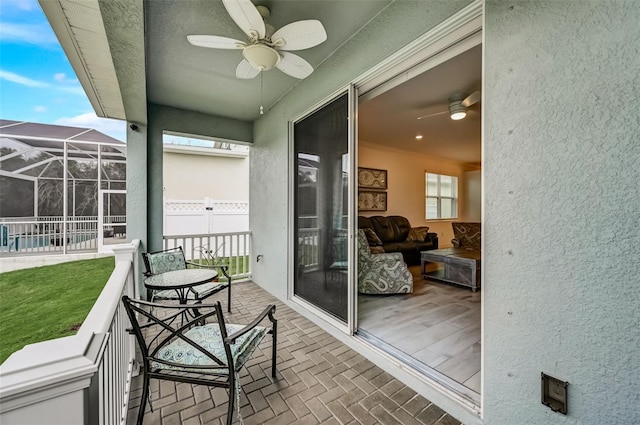 balcony featuring a ceiling fan