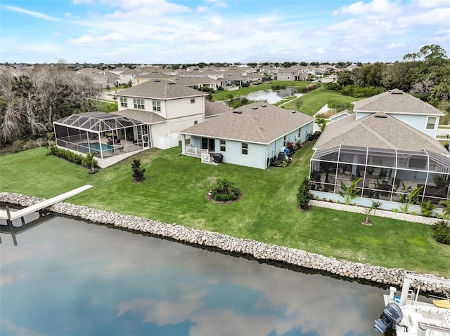 aerial view of residential area featuring a nearby body of water