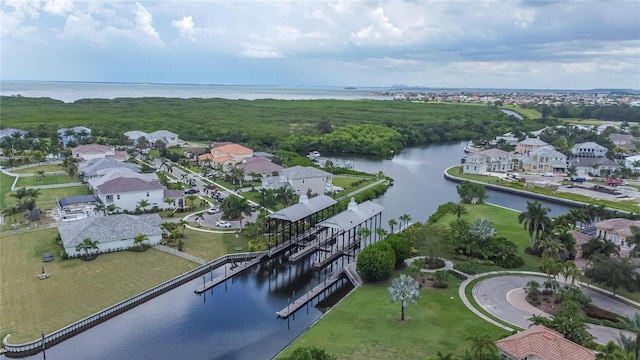 aerial perspective of suburban area with a large body of water