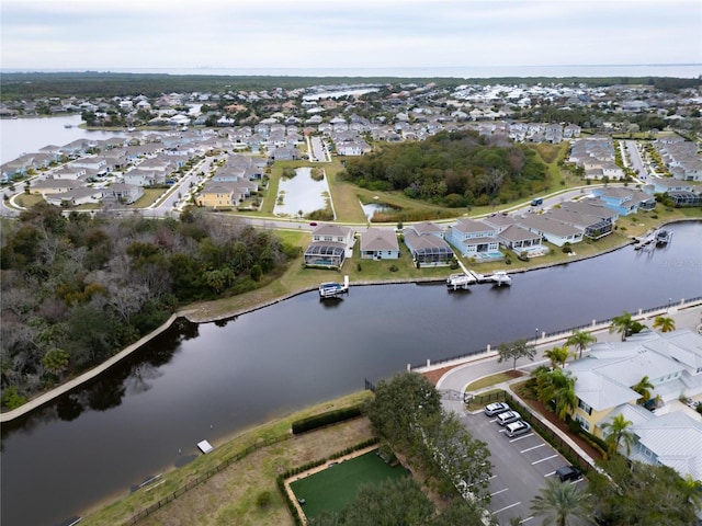 aerial overview of property's location featuring a large body of water and nearby suburban area