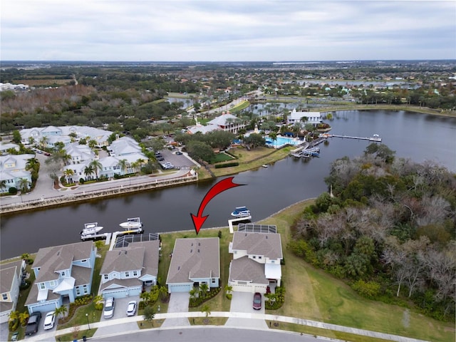 aerial overview of property's location featuring nearby suburban area and a large body of water