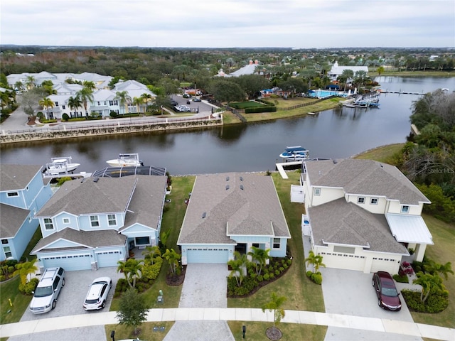 aerial perspective of suburban area with a large body of water
