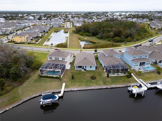 aerial perspective of suburban area with a nearby body of water