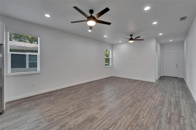 6097 Vermont Ave, New Port Richey, FL 34653 - spare room featuring a ceiling fan, healthy amount of natural light, wood finished floors, and recessed lighting