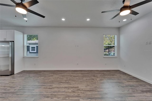 6097 Vermont Ave, New Port Richey, FL 34653 - spare room with ceiling fan, wood finished floors, baseboards, and recessed lighting