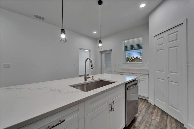 6097 Vermont Ave, New Port Richey, FL 34653 - kitchen with a sink, stainless steel dishwasher, white cabinets, light stone countertops, and pendant lighting