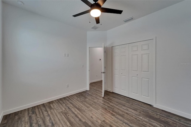 6097 Vermont Ave, New Port Richey, FL 34653 - unfurnished bedroom with wood finished floors, baseboards, a closet, and ceiling fan