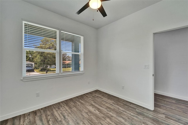 6097 Vermont Ave, New Port Richey, FL 34653 - spare room featuring a ceiling fan, wood finished floors, and baseboards