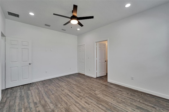 6097 Vermont Ave, New Port Richey, FL 34653 - unfurnished bedroom with dark wood-style flooring, baseboards, recessed lighting, and a ceiling fan