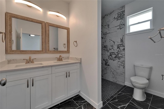6097 Vermont Ave, New Port Richey, FL 34653 - bathroom with marble look tiles, toilet, baseboards, double vanity, and a tile shower