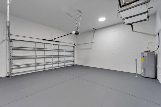 6097 Vermont Ave, New Port Richey, FL 34653 - garage with water heater, a garage door opener, concrete block wall, and recessed lighting