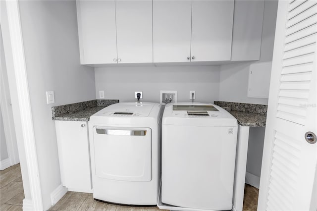 1325 Snell Isle Blvd NE Unit 505, Saint Petersburg, FL 33704 - laundry room with cabinet space, washer and dryer, baseboards, and light wood-style floors