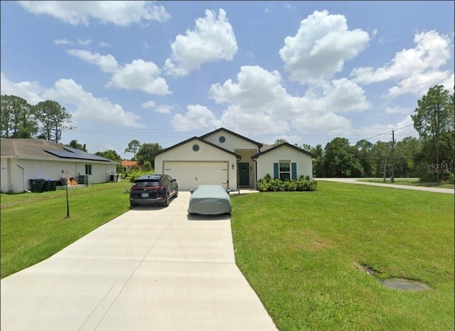 5407 Kedgewick Ln, North Port, FL 34288 - single story home featuring concrete driveway, a front yard, and a garage