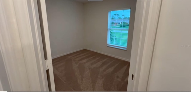 5407 Kedgewick Ln, North Port, FL 34288 - spare room featuring carpet floors and baseboards
