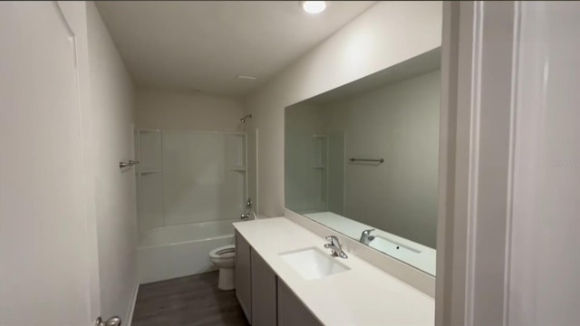 5407 Kedgewick Ln, North Port, FL 34288 - full bathroom with vanity, toilet, shower / bathtub combination, and wood finished floors