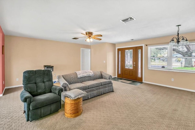 1666 Souvenir Dr, Clearwater, FL 33755 - living area with carpet flooring, baseboards, a chandelier, and a ceiling fan