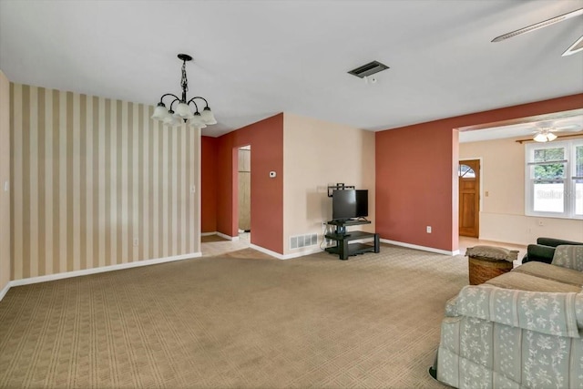 1666 Souvenir Dr, Clearwater, FL 33755 - living area with carpet, ceiling fan, baseboards, and a chandelier