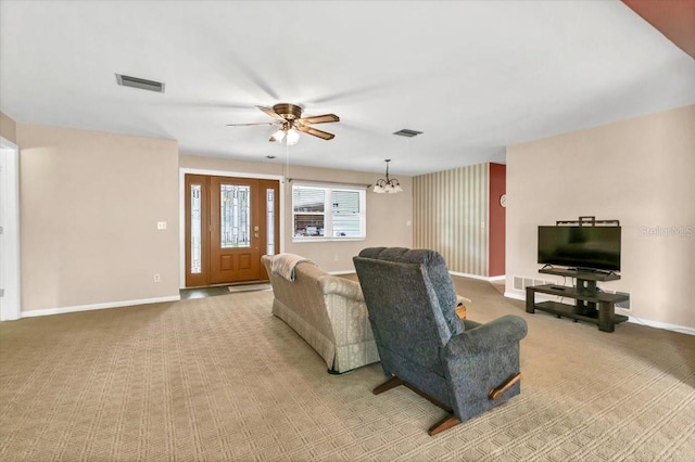 1666 Souvenir Dr, Clearwater, FL 33755 - living area with carpet flooring, baseboards, a ceiling fan, and a chandelier