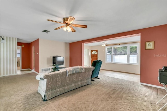 1666 Souvenir Dr, Clearwater, FL 33755 - living room featuring a ceiling fan, light colored carpet, and baseboards