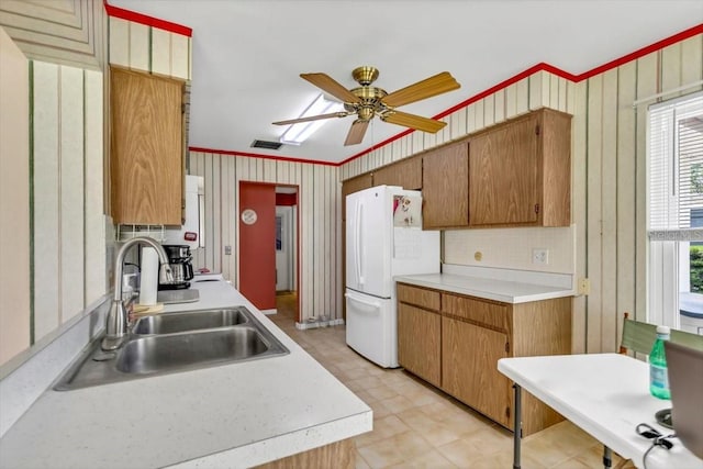 1666 Souvenir Dr, Clearwater, FL 33755 - kitchen featuring a sink, freestanding refrigerator, light countertops, a ceiling fan, and light floors