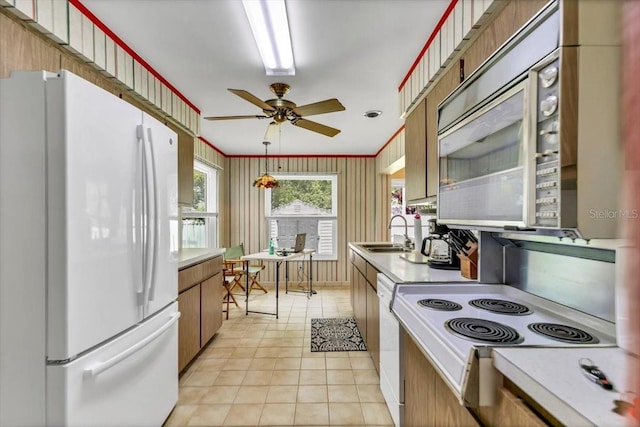 1666 Souvenir Dr, Clearwater, FL 33755 - kitchen featuring white appliances, a sink, light tile patterned flooring, a ceiling fan, and light countertops