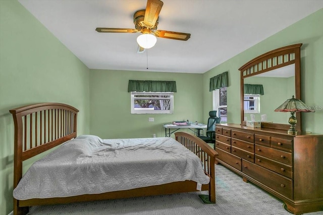 1666 Souvenir Dr, Clearwater, FL 33755 - bedroom with carpet flooring, a ceiling fan, and a desk