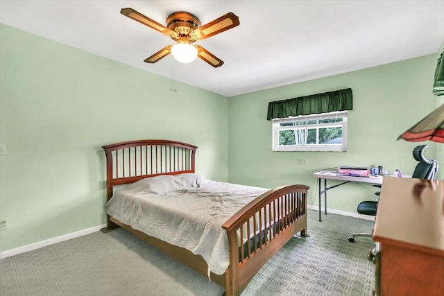 1666 Souvenir Dr, Clearwater, FL 33755 - bedroom with carpet, baseboards, an office area, and a ceiling fan