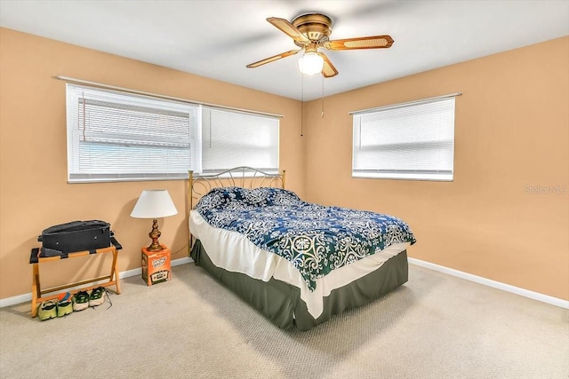 1666 Souvenir Dr, Clearwater, FL 33755 - carpeted bedroom with baseboards and ceiling fan