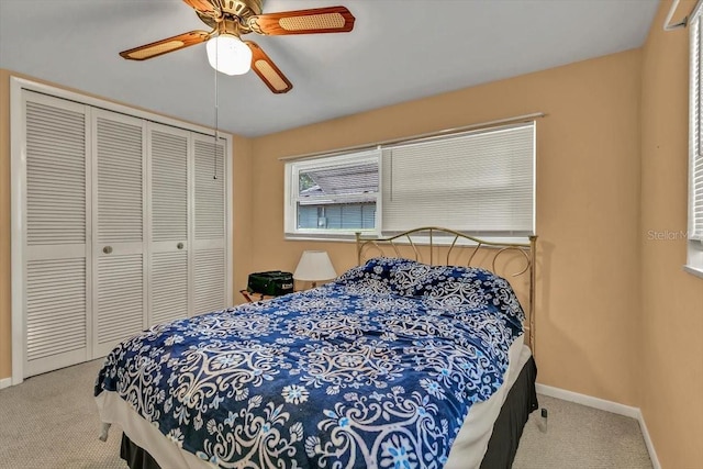 1666 Souvenir Dr, Clearwater, FL 33755 - carpeted bedroom with a closet, baseboards, and a ceiling fan