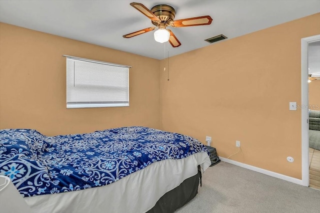 1666 Souvenir Dr, Clearwater, FL 33755 - bedroom with carpet flooring, baseboards, and ceiling fan