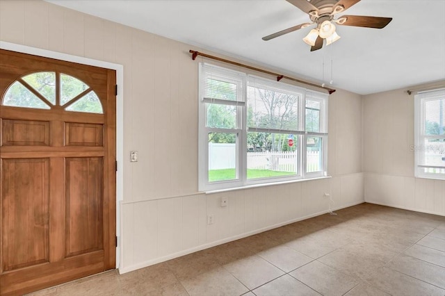 1666 Souvenir Dr, Clearwater, FL 33755 - foyer entrance with light tile patterned floors, ceiling fan, and baseboards