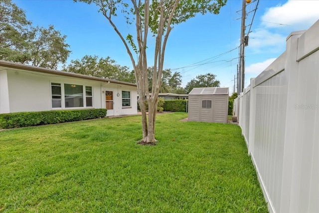 1666 Souvenir Dr, Clearwater, FL 33755 - view of grassy yard with a storage shed and an outdoor structure