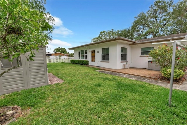 1666 Souvenir Dr, Clearwater, FL 33755 - back of property with stucco siding and a patio