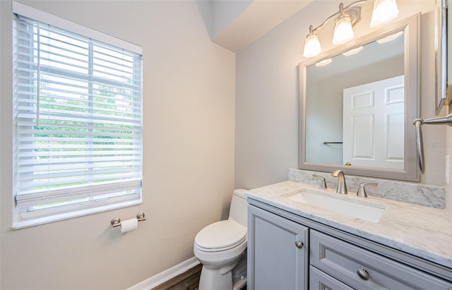 1712 Crossvine Ct, Trinity, FL 34655 - half bath featuring plenty of natural light, vanity, and wood finished floors