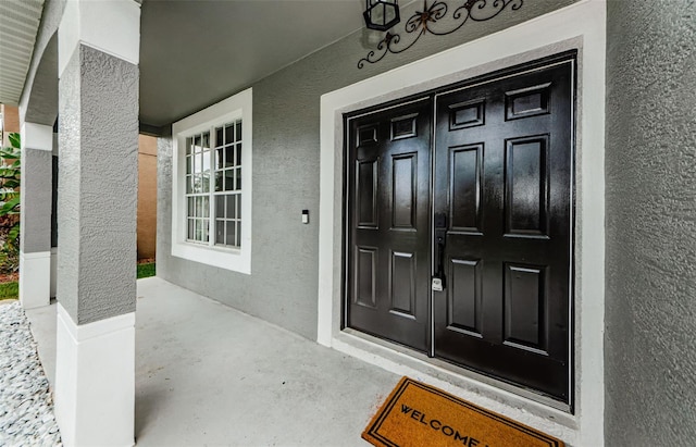 1712 Crossvine Ct, Trinity, FL 34655 - property entrance with stucco siding