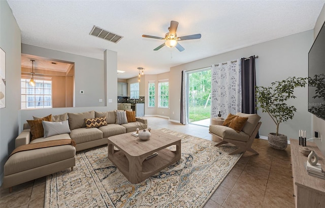 1712 Crossvine Ct, Trinity, FL 34655 - living room featuring ceiling fan and tile patterned flooring