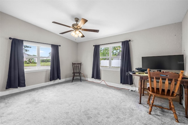 office area with lofted ceiling, ceiling fan, carpet flooring, and baseboards