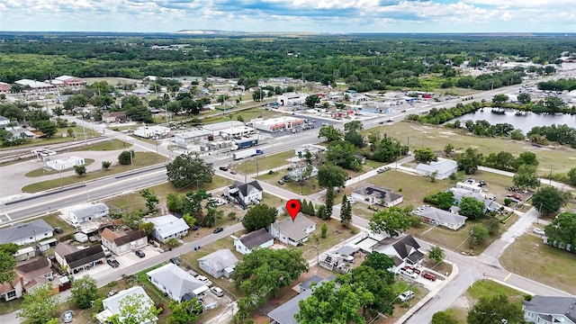 aerial view of residential area featuring a nearby body of water