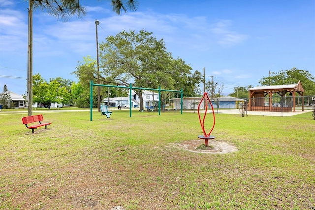 community jungle gym featuring a gazebo and a lawn