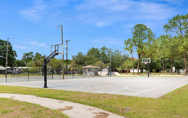view of basketball court featuring community basketball court and fence