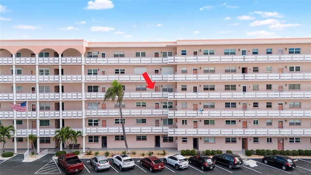 6025 Shore Blvd S Unit 409, Gulfport, FL 33707 - view of apartment building / complex featuring uncovered parking
